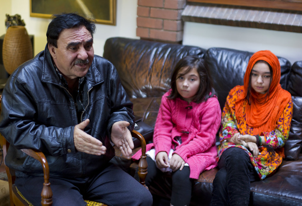 Mir Aman with his daughters Shahnaz (right) and Shakeela in Islamabad. Aman has no idea where his wife Maheerban Gul is being held.