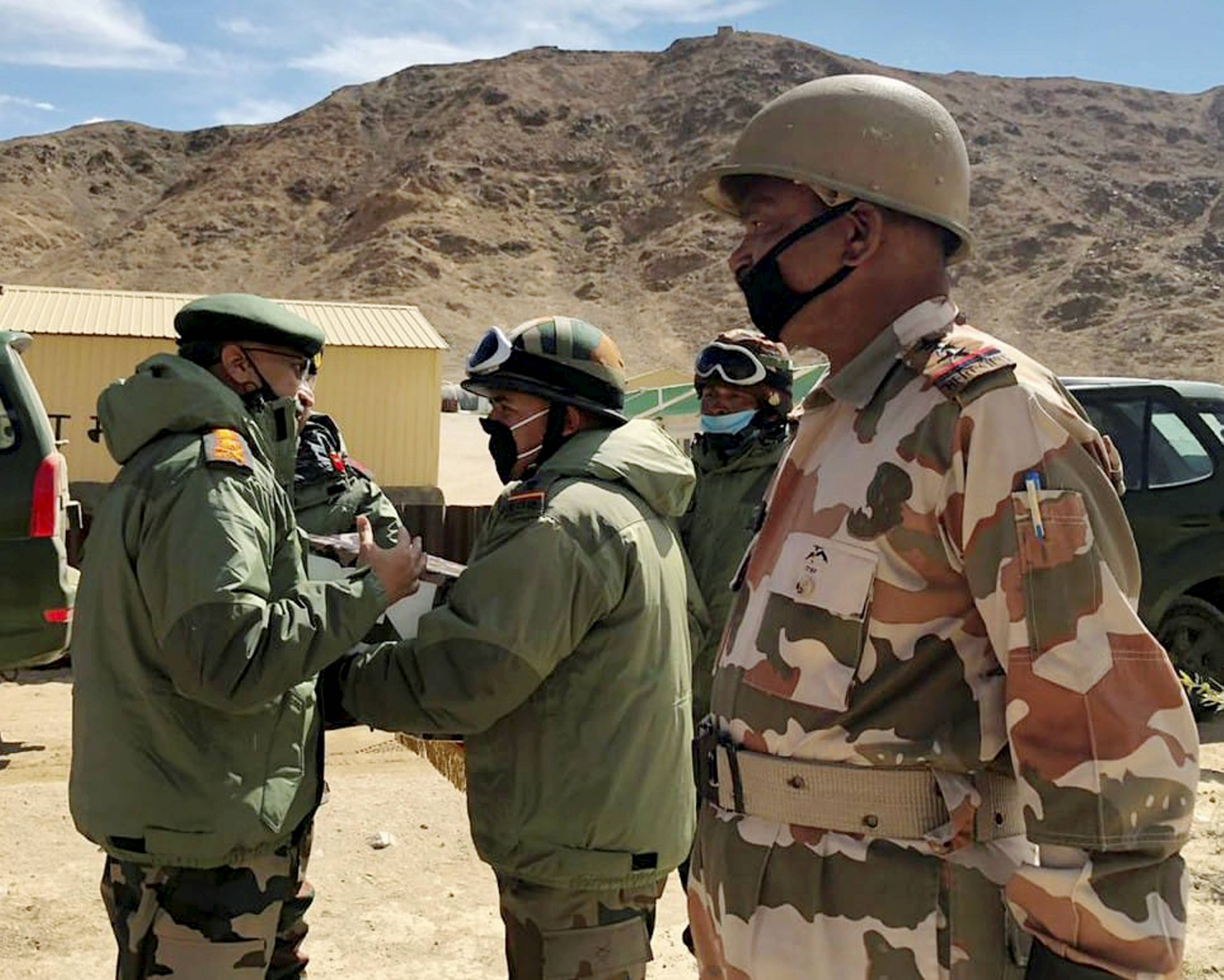 Army chief Gen. M.M. Naravane talks to troopers while reviewing the situation on the ground after the stand-off in eastern Ladakh on June 24 