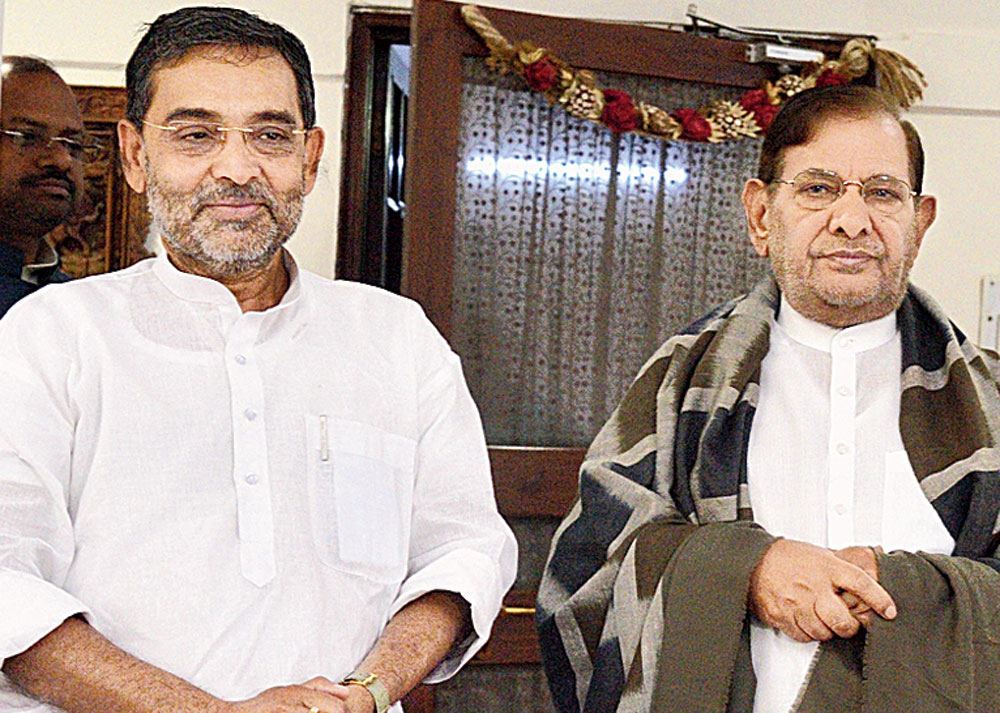 New friends: Union minister and RLSP chief Upendra Kushwaha meets expelled JDU leader Sharad Yadav in New Delhi on Monday. 
