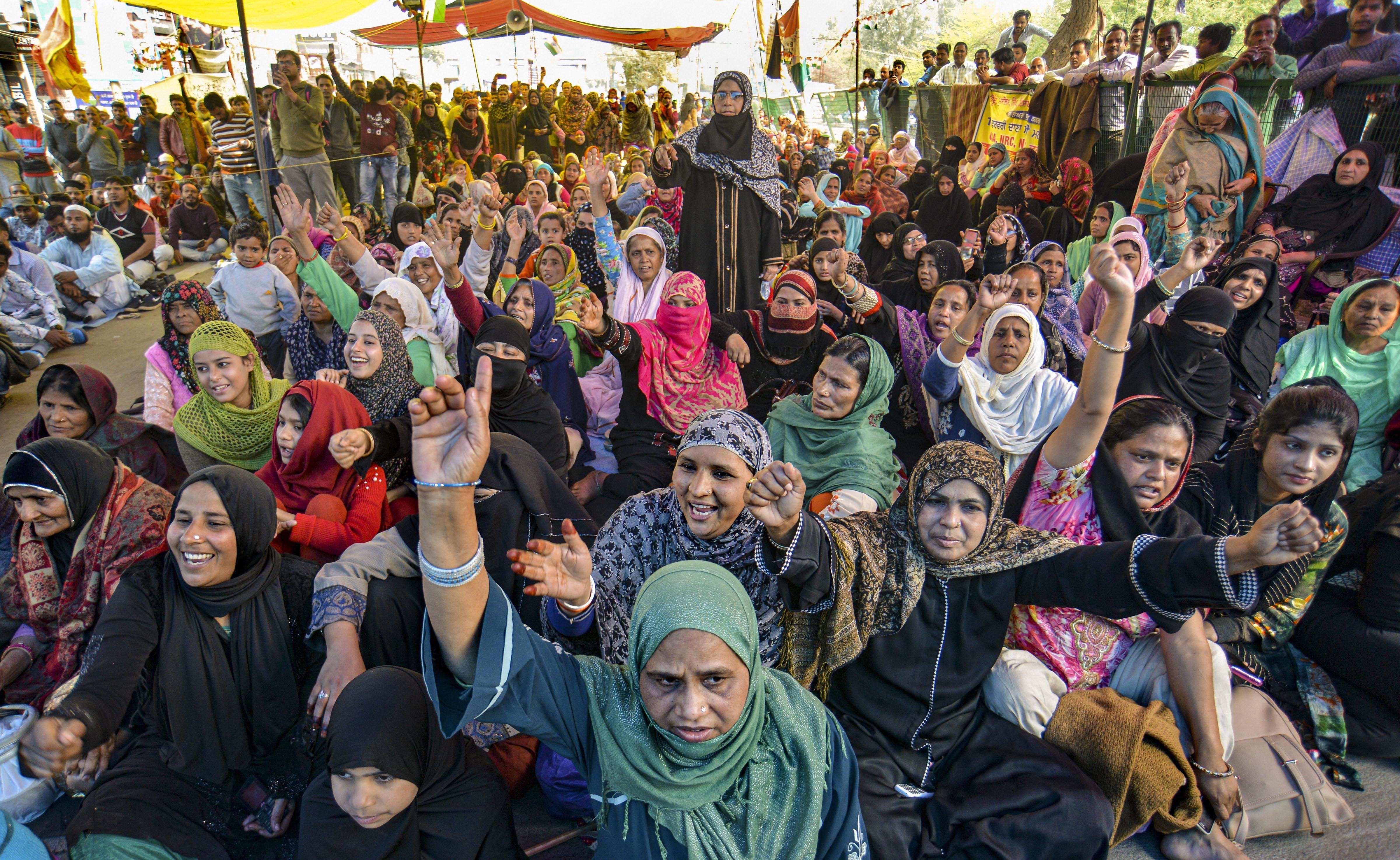 Protesters raise slogans during a demonstration against the amended Citizenship Act and National Register of Citizens at Shaheen Bagh, in New Delhi, Sunday, February 23, 2020