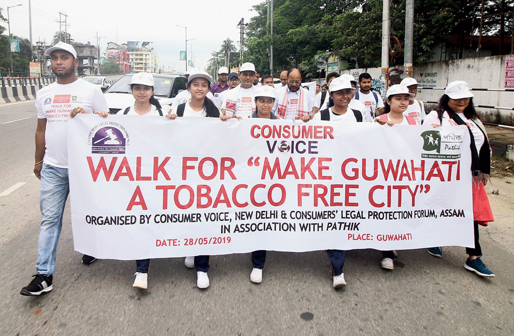Students participate in a walkathon to observe World No Tobacco Day in Guwahati on Tuesday