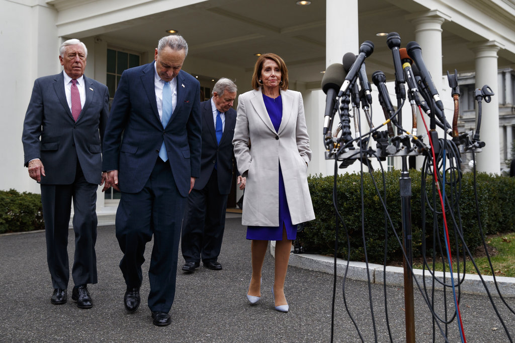 (From left) House Majority Leader Steny Hoyer., Senate Minority Leader Chuck Schumer, Sen. Dick Durbin and Speaker of the House Nancy Pelosi  walk to speak to reporters after meeting Donald Trump about border security in the Situation Room of the White House on Friday.