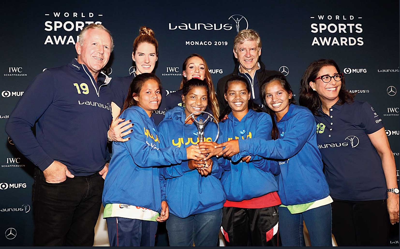 The Yuwa girls with former Arsenal manager Arsene Wenger and  Olympic swimming champ Missy Franklin at the awards ceremony in Monaco on Sunday.