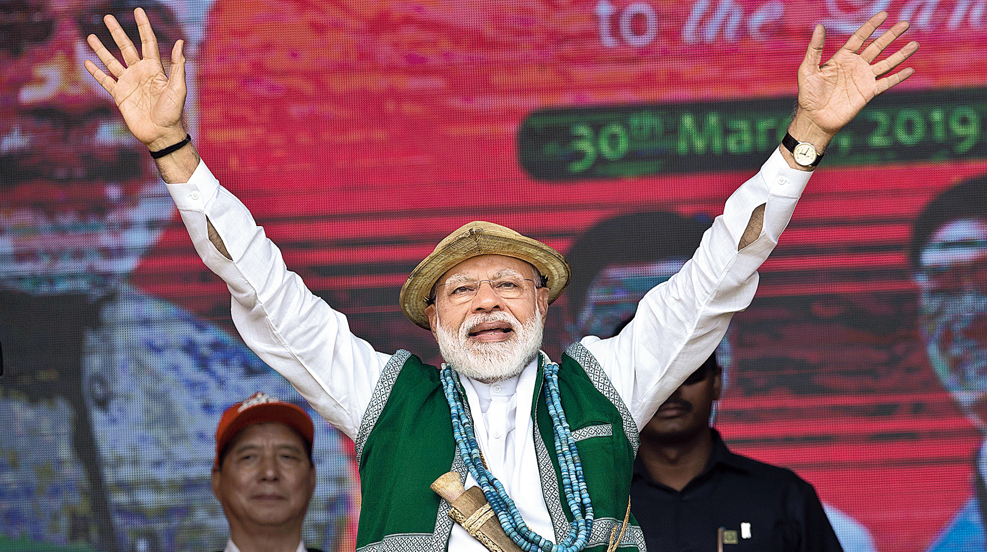 Prime Minister Narendra Modi waves to BJP supporters at the rally in Arunachal Pradesh’s Aalo on Saturday.