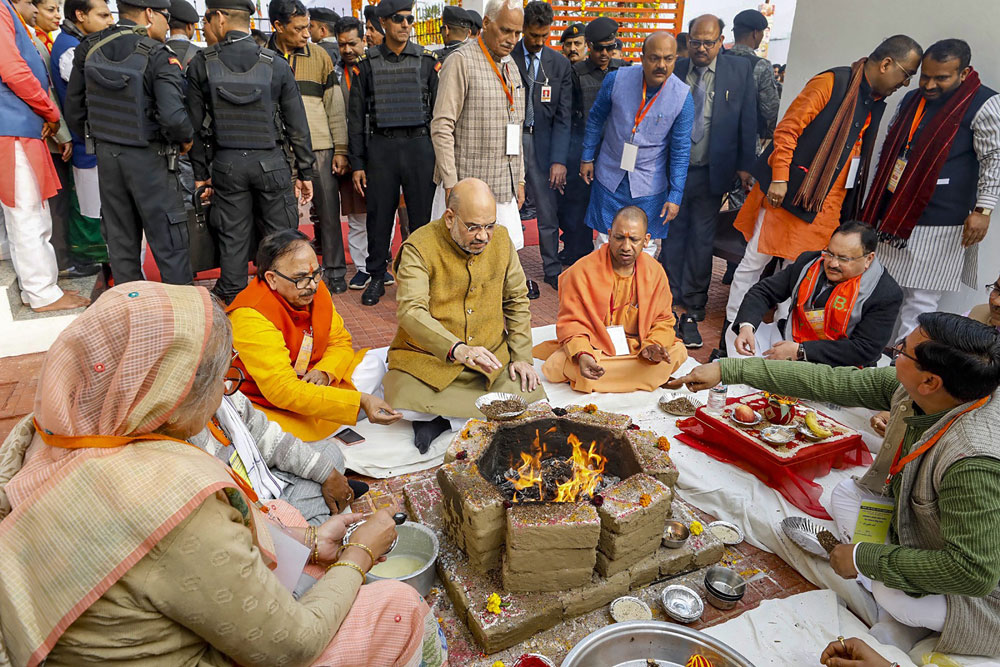 BJP president Amit Shah and Uttar Pradesh chief minister Yogi Adityanath perform a ceremony to inaugurate 51 district BJP offices in Bulandshahr on Wednesday.