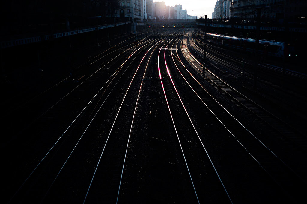Empty railway tracks outside the Saint Lazare train station in Paris on December 31, 2019. The strikes over the French government's plan to revamp the retirement system have disrupted transport across France and beyond, hobbling Paris Metros and trains across the country as well as businesses.