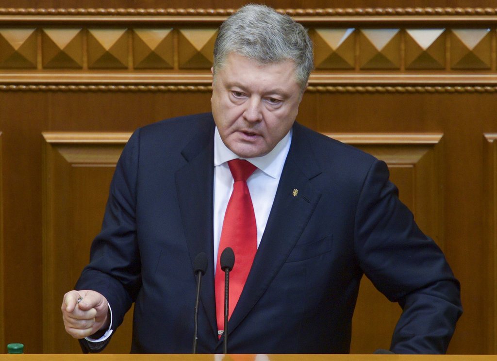 President Petro Poroshenko has urged NATO to deploy naval ships to the Sea of Azov amid the standoff with Russia.