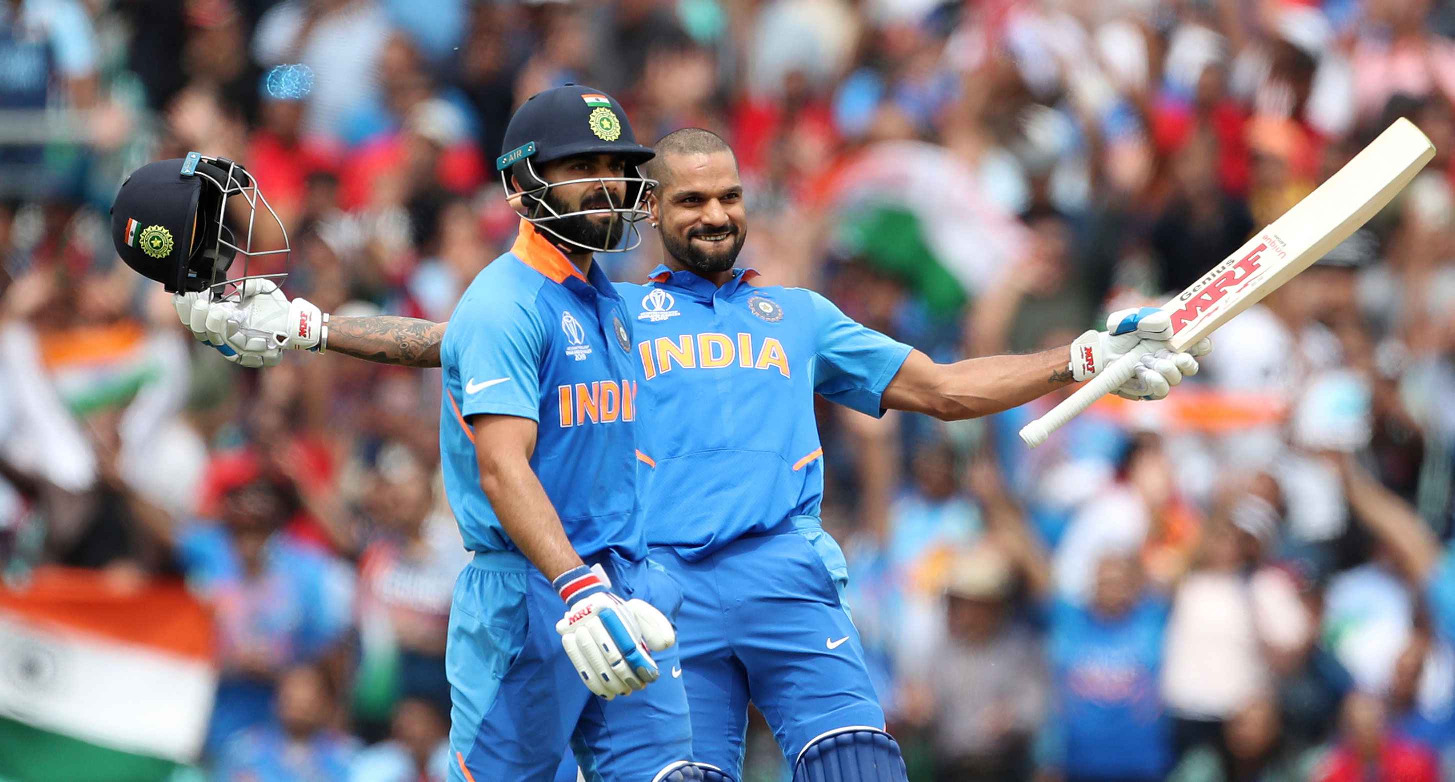 Virat Kohli and Shikhar Dhawan after the latter scored a century during the ICC Cricket World Cup match between Australia and India at The Oval in London, on June 9, 2019.  