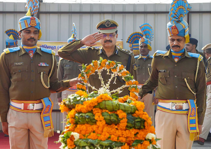 Central Reserve Police Force (CRPF) officers lays a wreath on the coffin of CRPF constable Ramesh Ranjan; who was killed during a gun-battle with terrorists at Parim Pora area of Kashmir; during a tribute paying ceremony at the Jaiprakash Narayan Airport in Patna, on Thursday