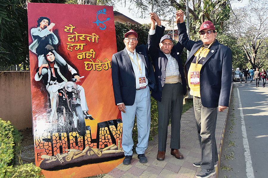 Friends from the 1960 batch of IIT(ISM) pose with a Sholay poster in Dhanbad on Sunday. 