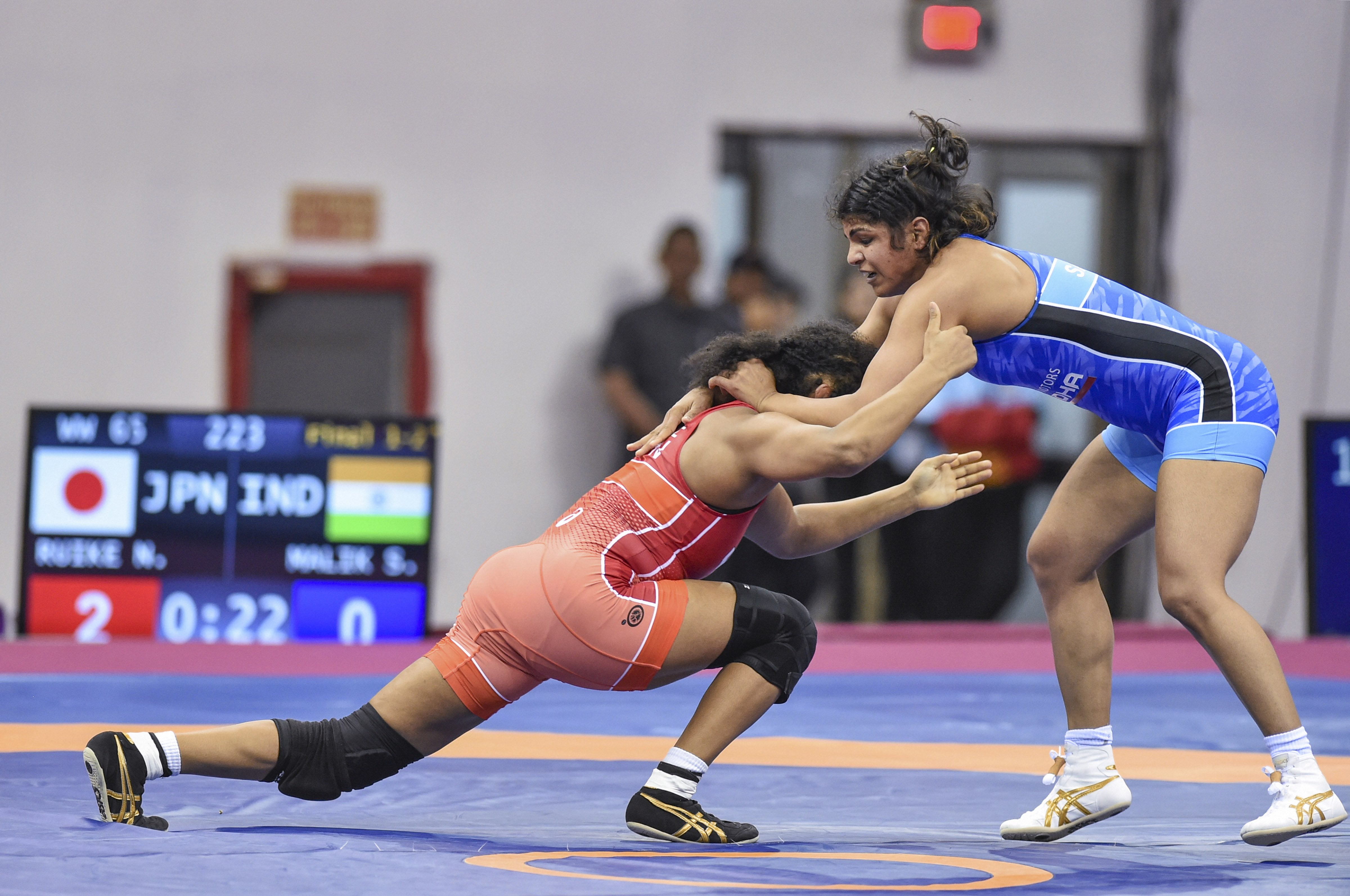 Japan's Naomi Rukie during her bout against India's Sakshi Malik during the 65kg category match of the Asian Wrestling Championships in New Delhi. Sakshi took the silver.