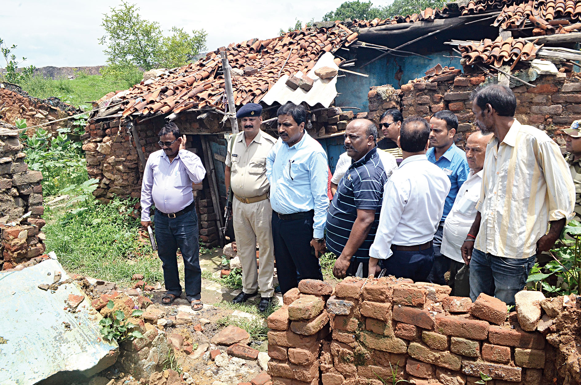 SDO Raj Maheshwaram (third from left) inspects the Mallahpatti locality in Dhanbad on Tuesday. 