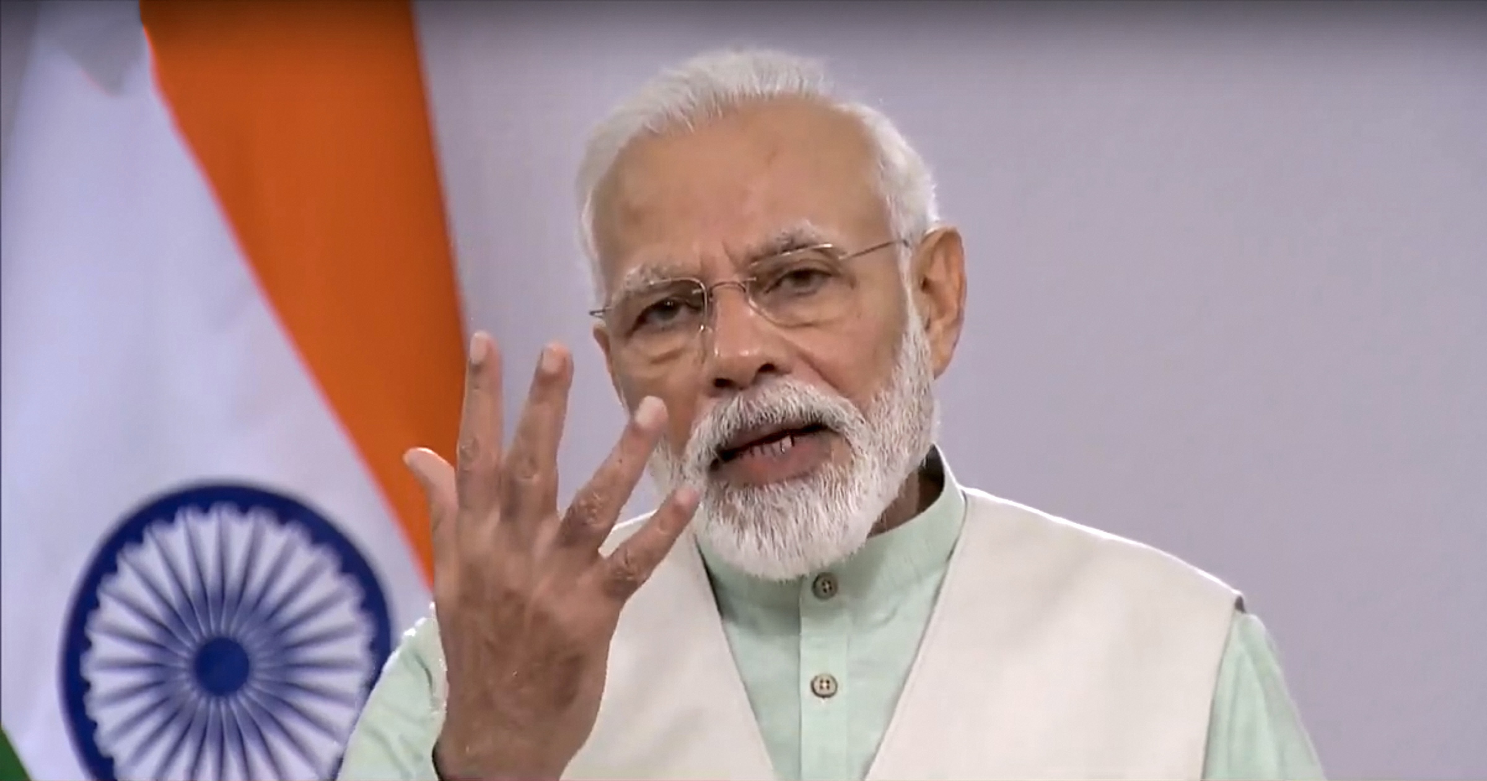 Prime Minister Narendra Modi addresses the nation on COVID-19 via a video message, in New Delhi, Friday, April 3, 2020. PM Modi urged people to switch off lights of their homes at 9 pm for nine minutes on April 5 and light up lamps, candles, mobile flashlights to display the nations collective spirit to defeat coronavirus.