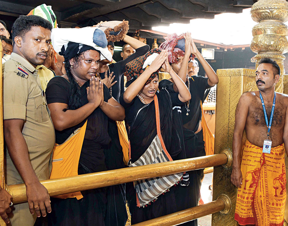 Transgender women pray at Sabarimala under police escort on Tuesday, December 18, 2018