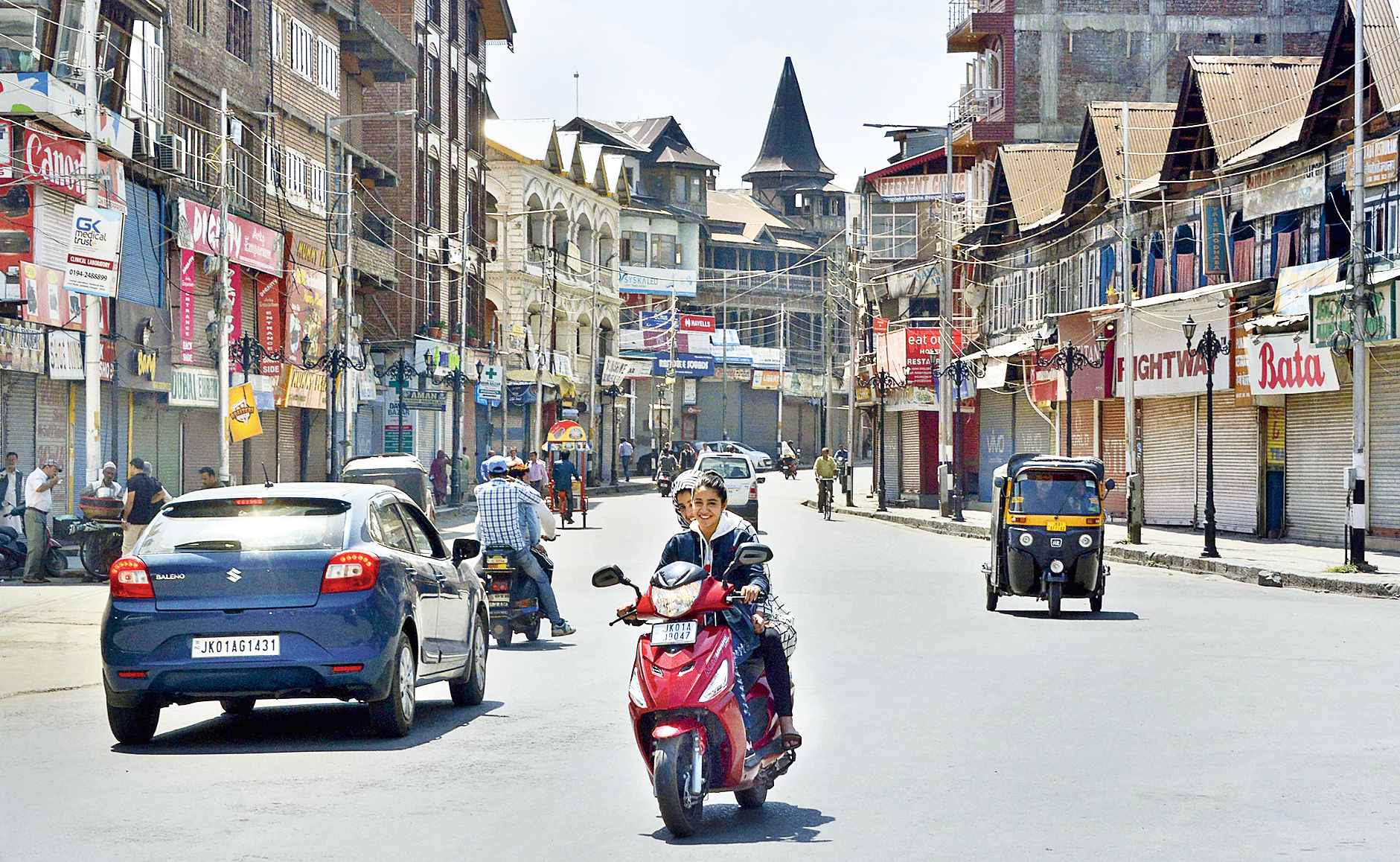 Commuters on a road near Lal Chowk, Srinagar, as the lockdown entered its 30th day on Tuesday. 