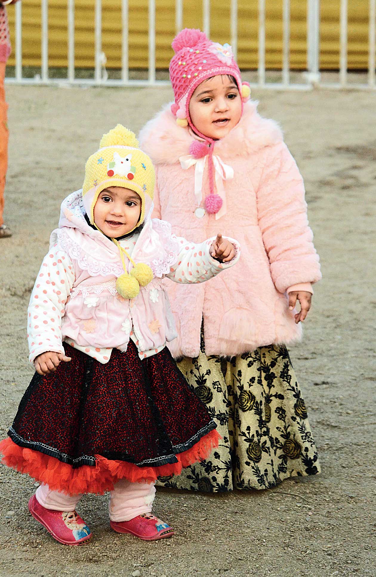 Kids covered head to toe in woollens make a pretty picture in Bistupur, Jamshedpur, on Sunday.