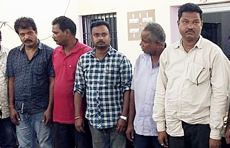 The arrested persons in the gambling racket.