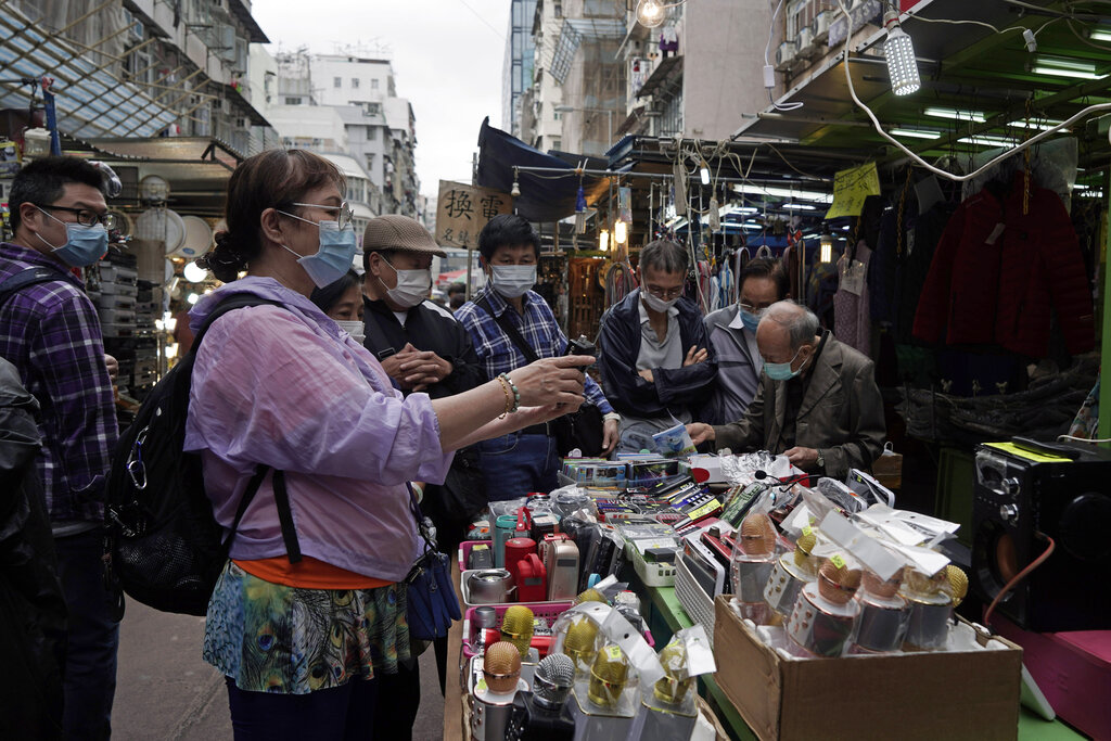 Customers wear masks at a market in Hong Kong on Tuesday