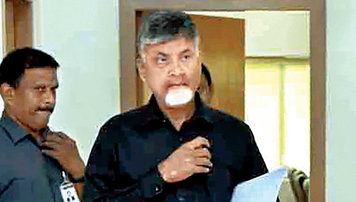 Naidu wears a black shirt as part of a “black day” protest against Modi’s visit to Andhra Pradesh . 
