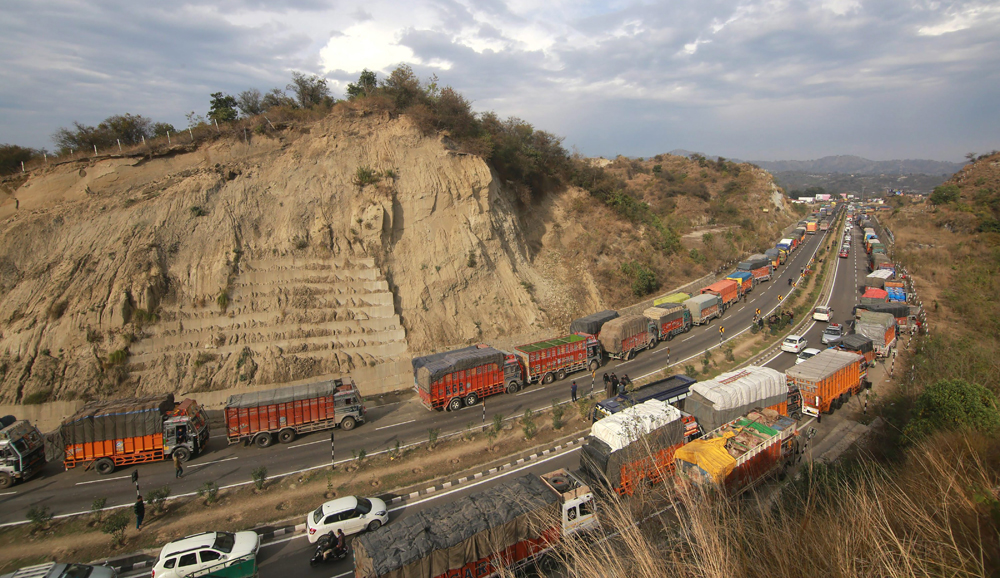 Stranded vehicles wait for the Jammu-Srinagar national highway to open on Wednesday, February 13, 2019. 
