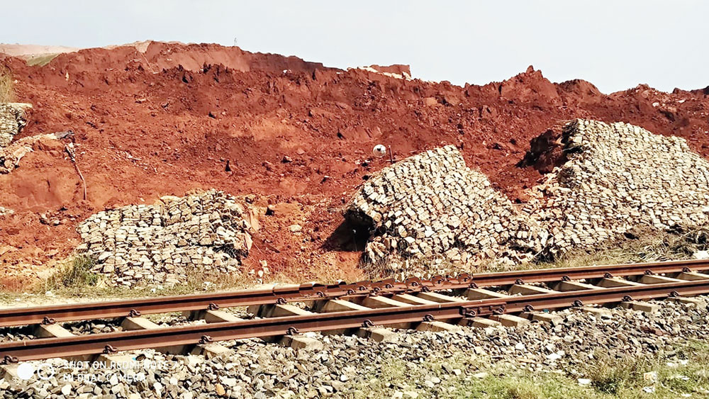 Industrial waste dumped along goods train tracks near Muri station on Tuesday. 
