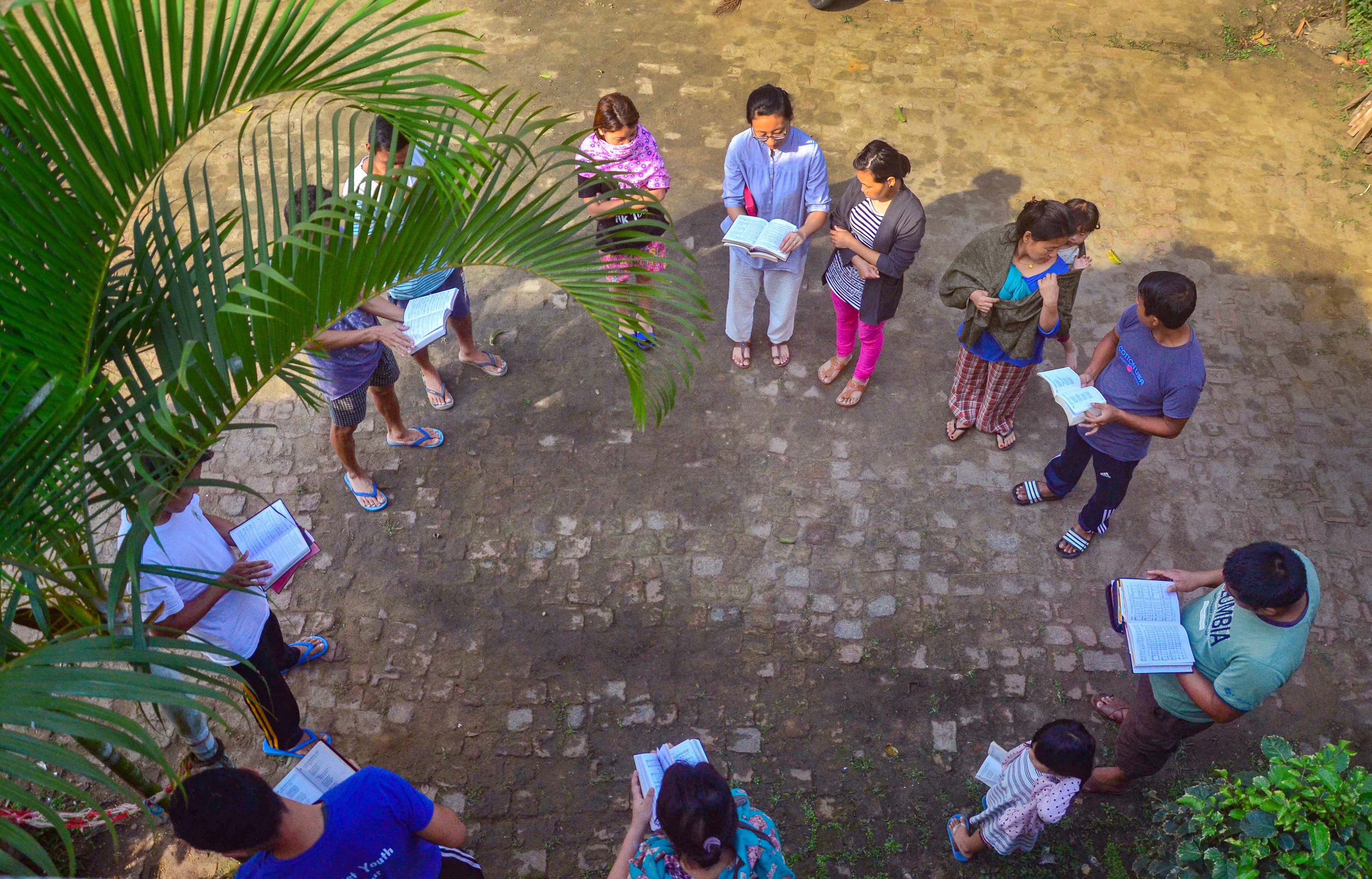 Christians sing a Gospel hymn during a special Easter fellowship outside their house, amid the nationwide Covid-19 lockdown, in Dimapur, Nagaland, Sunday, April 12, 2020.