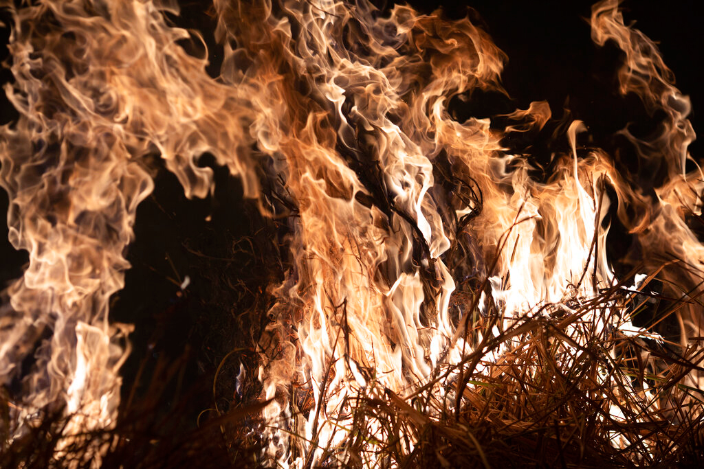 A fire burns a field on a farm in the Nova Santa Helena municipality, in the state of Mato Grosso, Brazil, Friday, August 23, 2019.