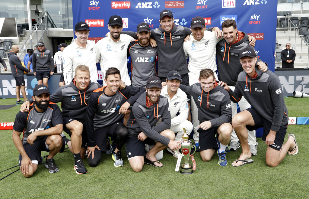 The New Zealand team pose with their trophy after wining the series against India 2-0 following play on day three of the second Test between New Zealand and India at Hagley Oval in Christchurch, New Zealand, Monday, March 2, 2020