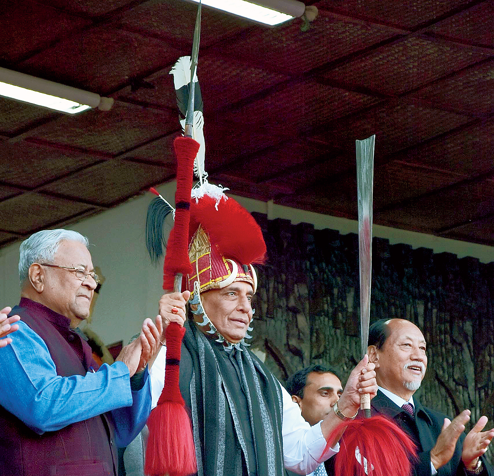 Union home minister Rajnath Singh, flanked by Nagaland governor P.B. Acharya and chief minister Neiphiu Rio, at the Hornbill Festival in Kisama village in Nagaland on Saturday.