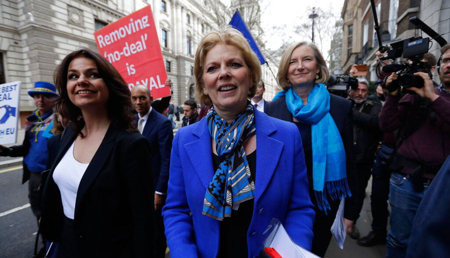 (From left) British politicians Heidi Allen, Anna Soubry and Sarah Wollaston arrive for a press conference in Westminster in London, Wednesday.