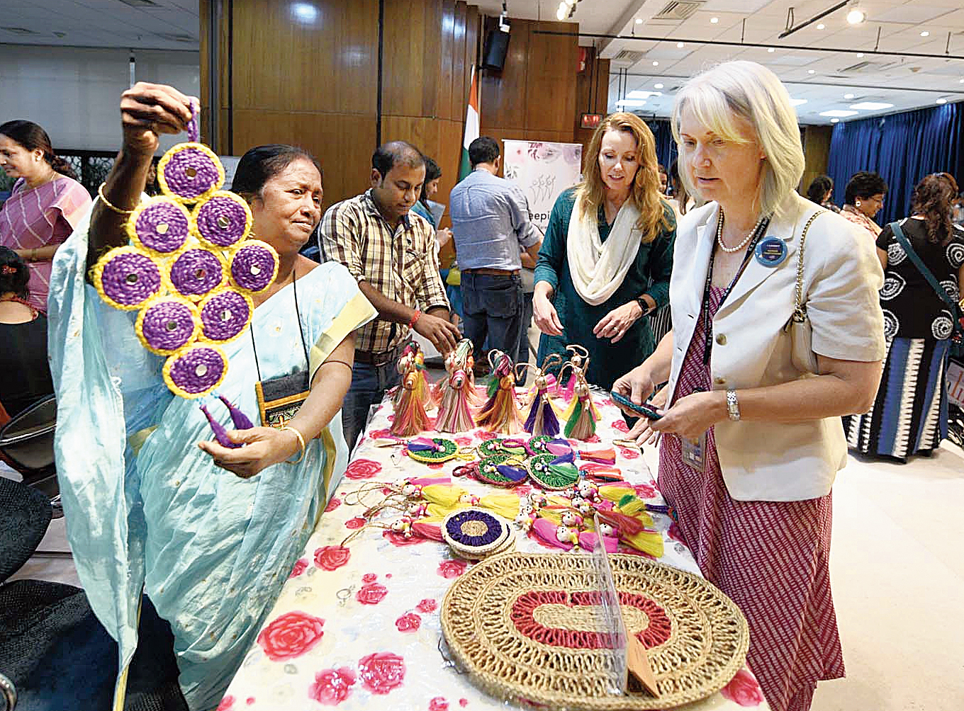 Rasina Bewa (in sari) shows a handicraft to US consul general Patti Hoffman (far right) at American Center on Friday. 