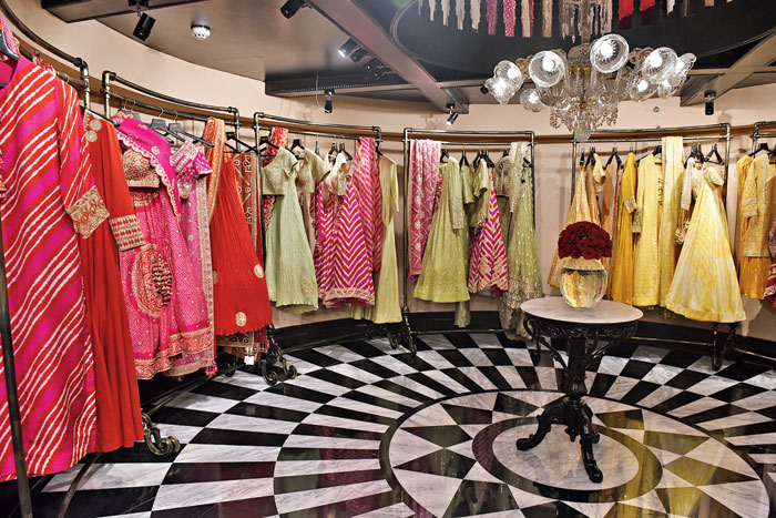 The ground floor of the store stocks lehngas, ready-to-wear saris, kurta and dupatta sets and Anarkalis in bright colours like pink, red and yellow as well as pastels. Lots of Jaipuri print, Lucknowi chikan, bandhnis with chikan and bandhnis from Jaipur, Bhuj and Kutch. “We specialise in three-four crafts and we have mixed the creative. We usually have a lot of silks too that can be worn all year round. We also work a lot on nets and Benarasis. There is a lot of sequin work, metallic sequins, mukaish, gota patti, hand-printed polka blocks and pearl work on the outfits. I am a big Chanel fan, so I am very attracted to pearls. We don’t use anything that is screen-printed or done using machine. All are handmade and requires great time and effort,” said Karishma.