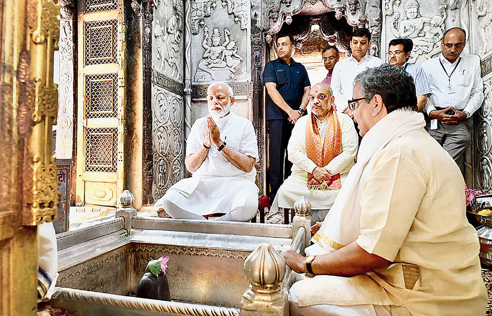 Prime Minister Narendra Modi, along with BJP president Amit Shah, offers prayers at the Kashi Vishwanath temple in Varanasi on Monday. 