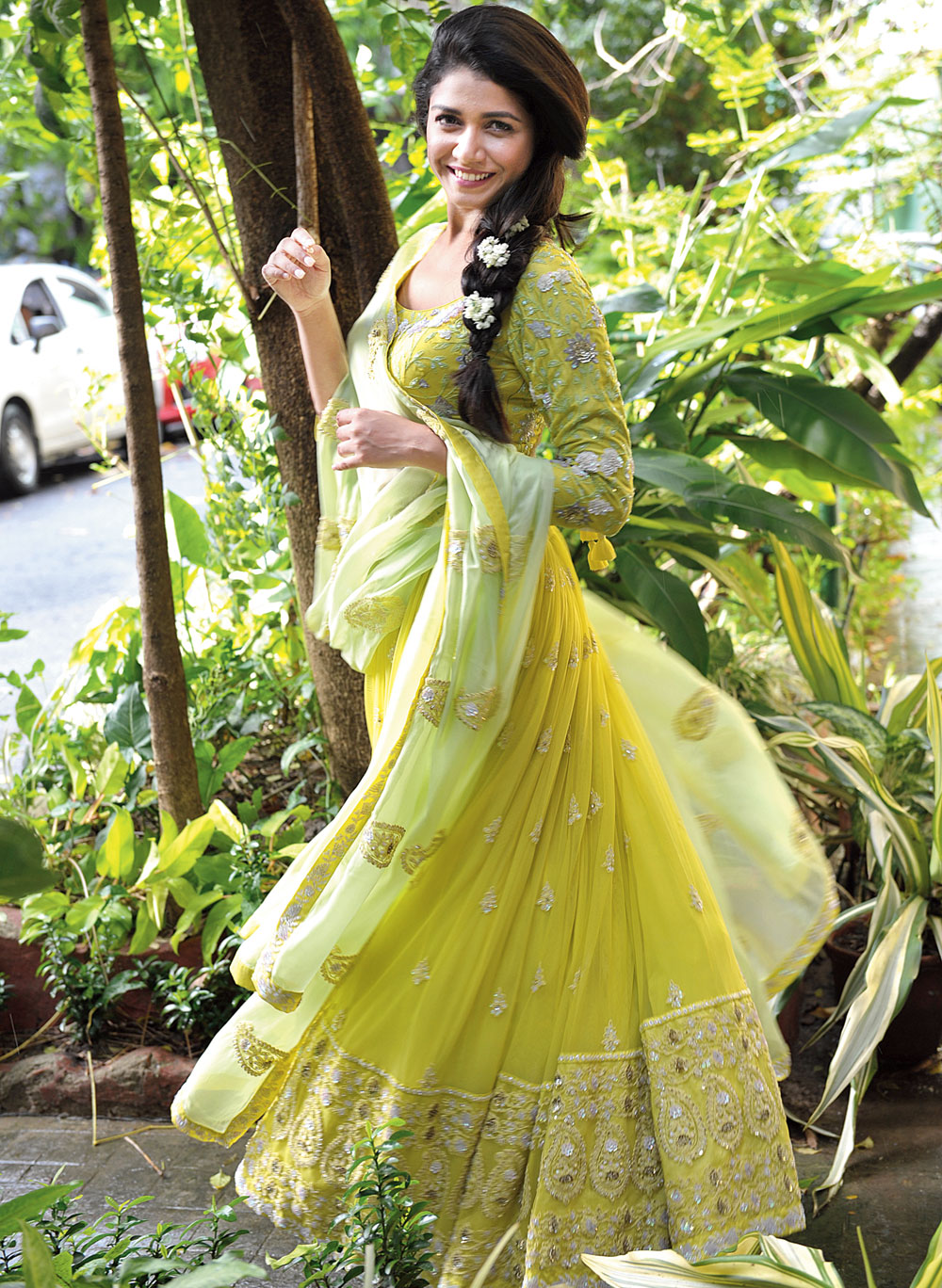 This lime green lehenga with hand-embroidery and sequin detailing lends a soft look. “This lehnga is flowy and we have kept the embroidery minimal with the choli and the border of the skirt intricately designed,” say Garo designer duo, Sweta Tantia and Priyangsu Maji