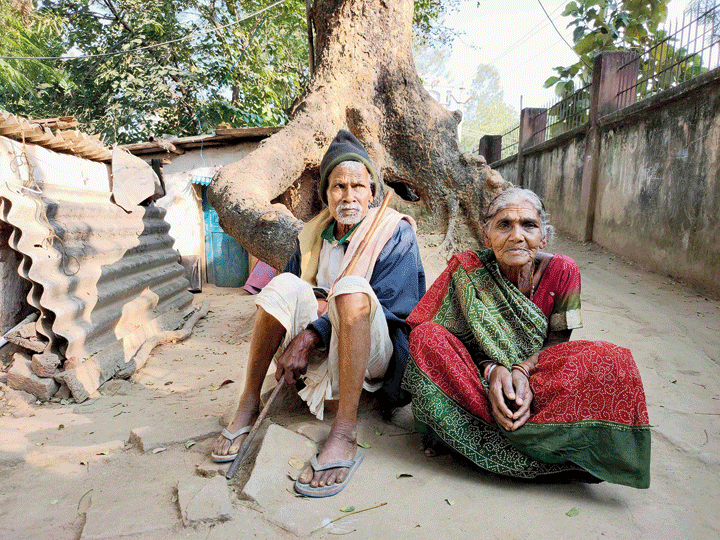 Phuchua and his wife Somari Devi outside their hut