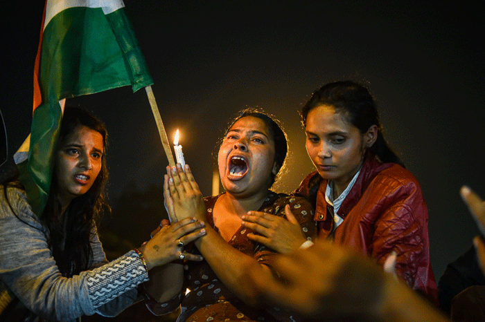 Activists during a candlelight march in solidarity with rape victims and to highlight the issue of violence against women in the country, in New Delhi, on Saturday