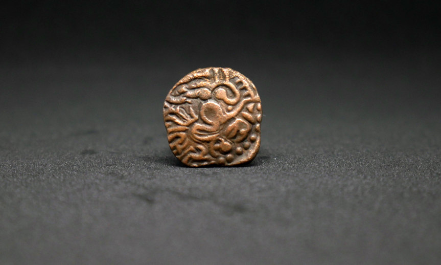 An ancient copper coin of the Chola dynasty. Ironically, in a New India obsessed with a mythical past, tangible heritage faces serious threats of obliteration.