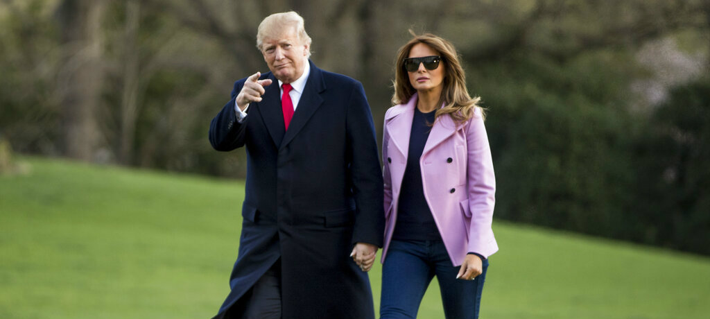 Donald Trump and Melania Trump walk along the South Lawn of the White House in Washington on Sunday. Trump is threatening anew to close the US-Mexico border as soon as this week if Mexico does not completely halt illegal immigration into the US.