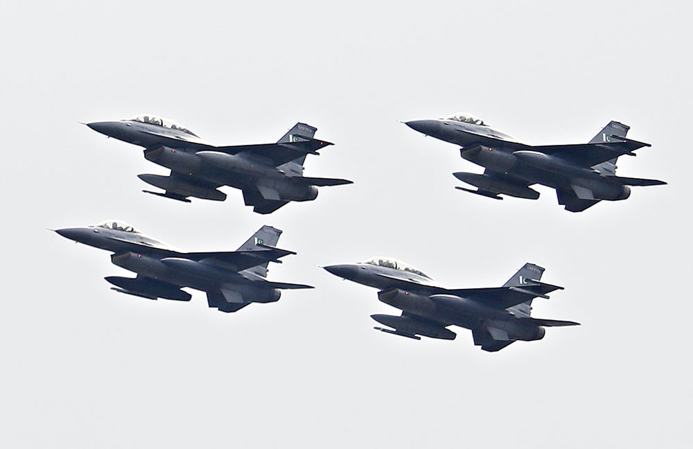 Pakistani Air Force F-16s fly in formation during the Pakistan National Day in Islamabad on March 23. 
