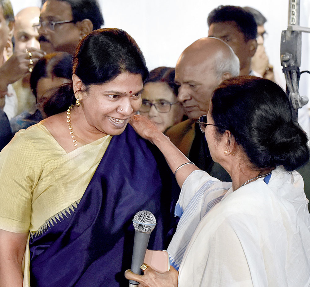 DMK leader Kanimozhi with Mamata Banerjee in Calcutta on Monday.