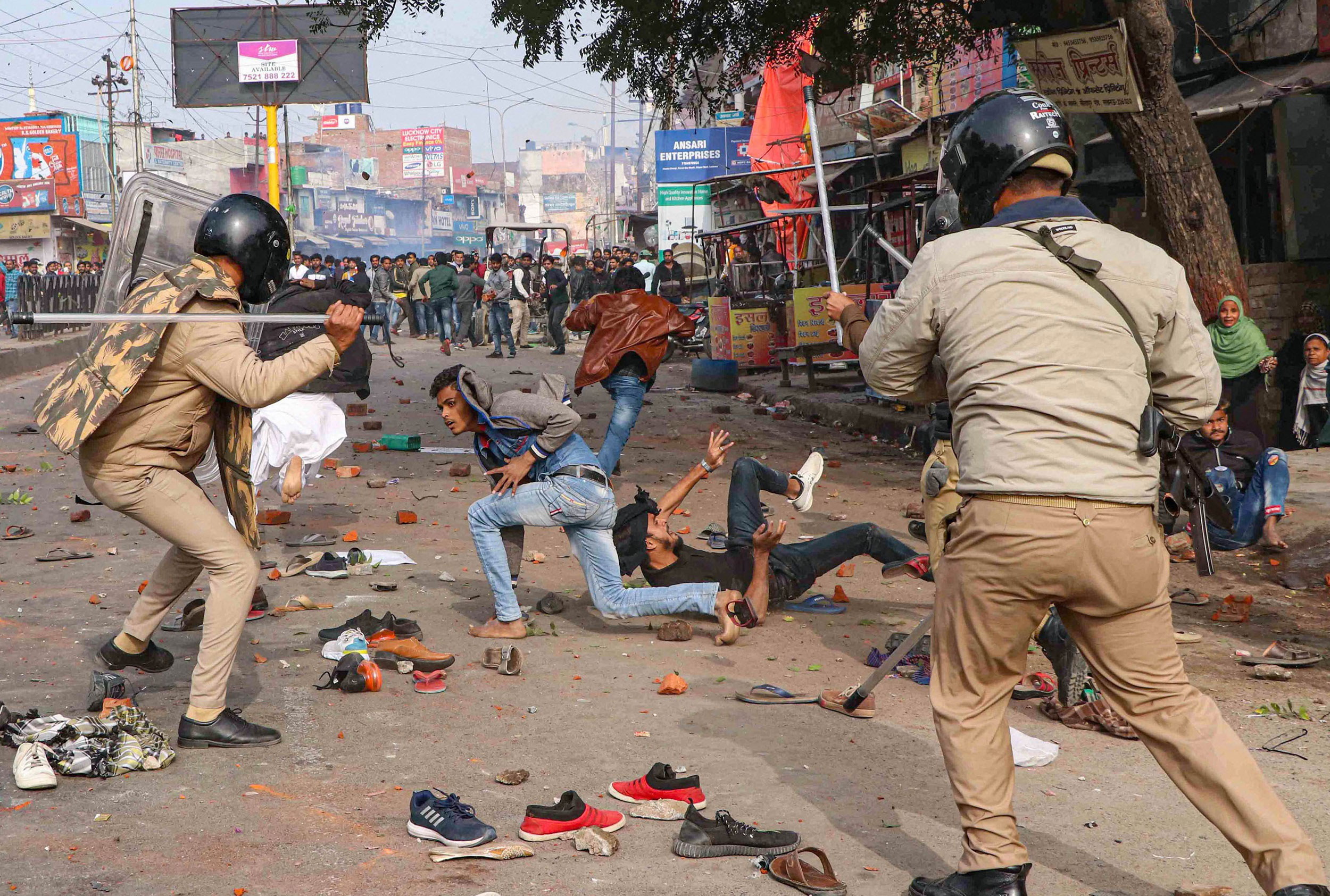 Police personnel hit protestors during a rally against the NRC and the amended Citizenship Act in Lucknow on Thursday.