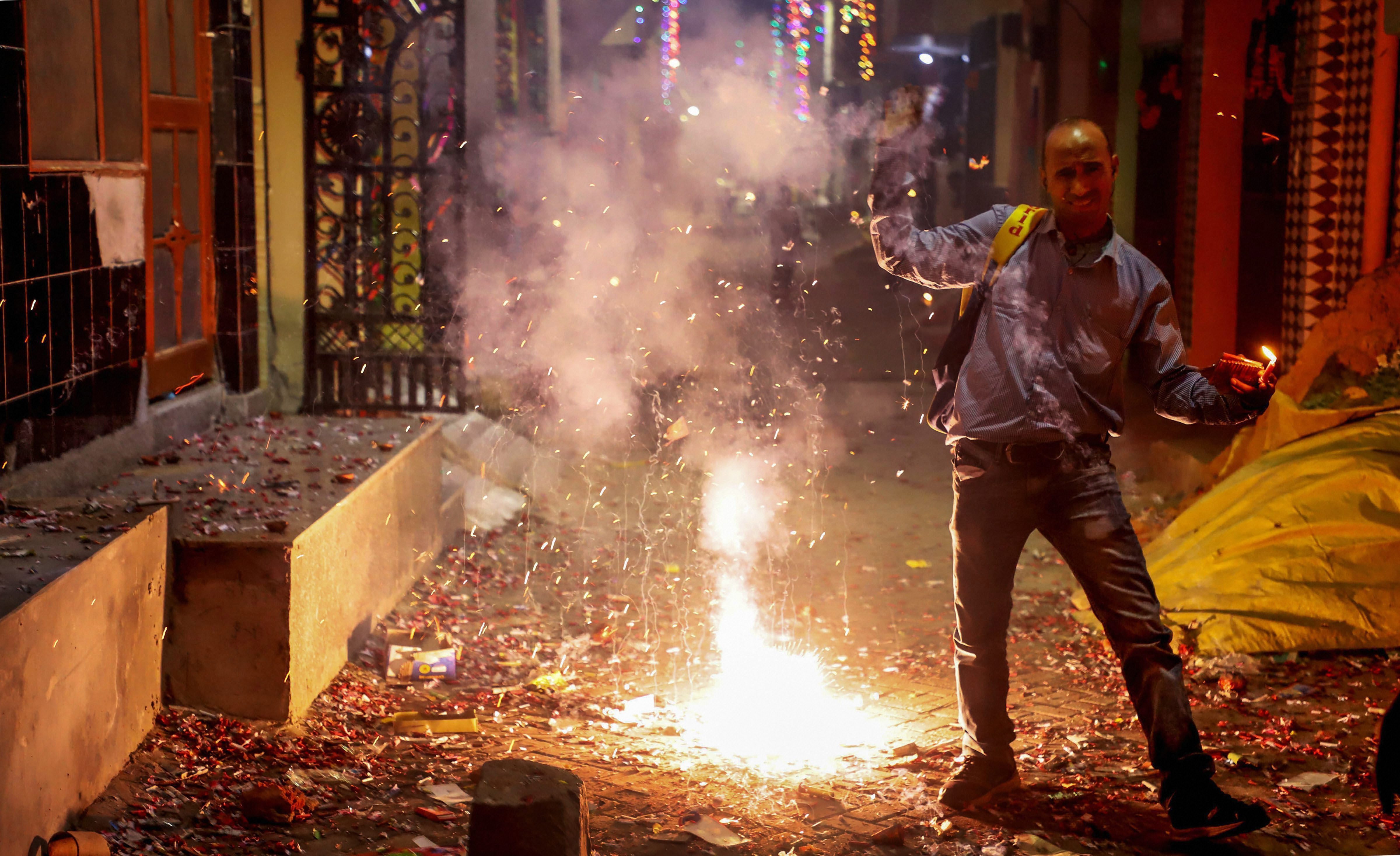 Smoke rises as people burn firecrackers to celebrate Diwali in Gurgaon on Wednesday, November 7.