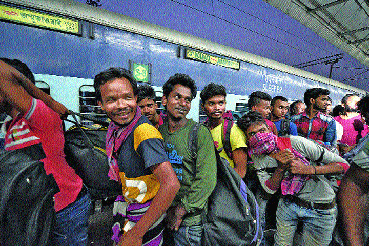 The labourers from Kashmir after their arrival at Kolkata station on Monday
