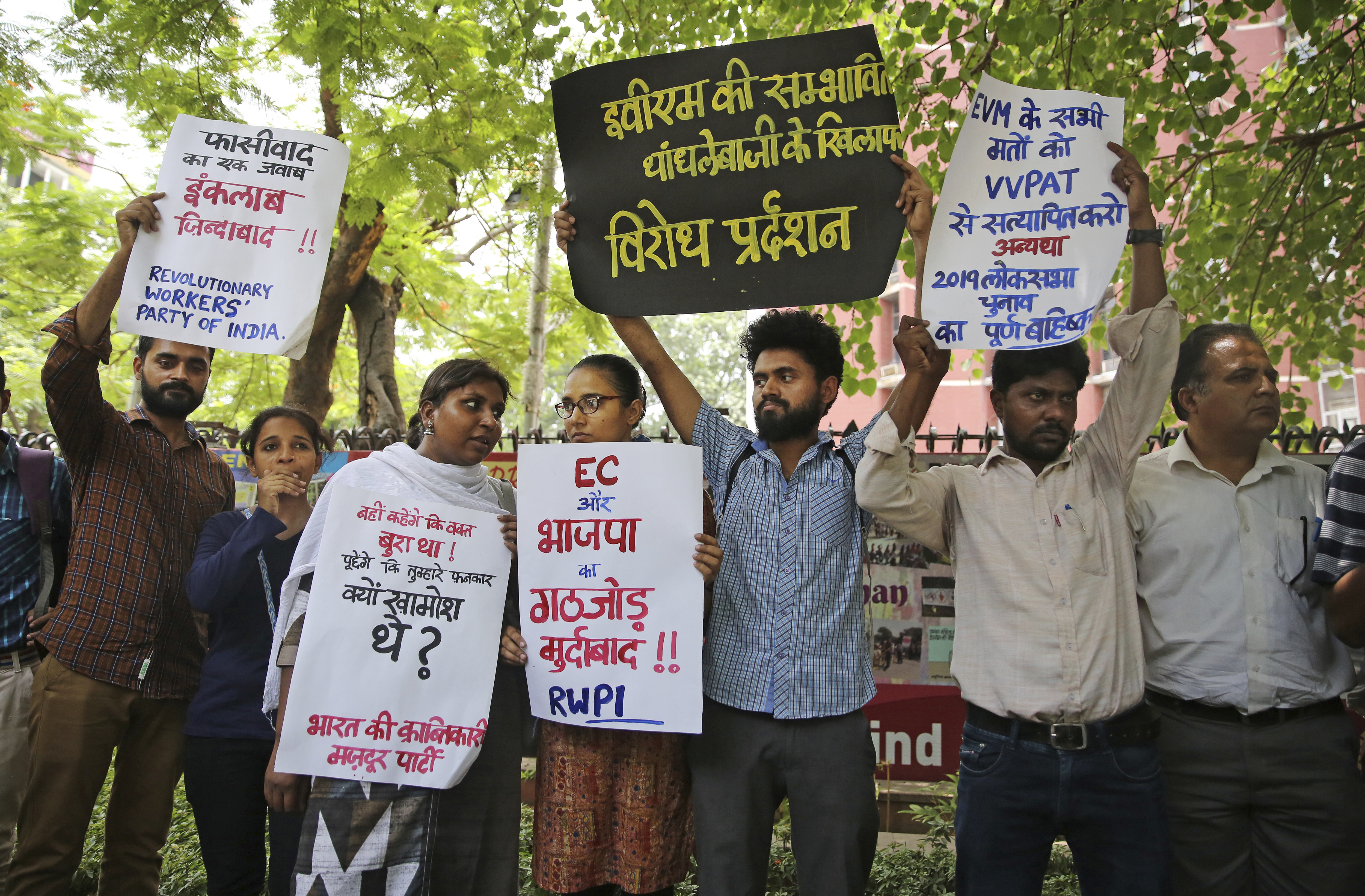 Activists of Revolutionary Workers' Party of India hold placards as they protest EVM tampering outside the Election Commission office in New Delhi on May 22, 2019.