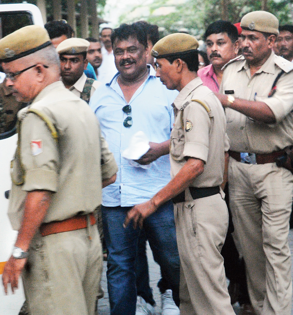 Jiten Dutta being produced in court in Guwahati on Saturday.