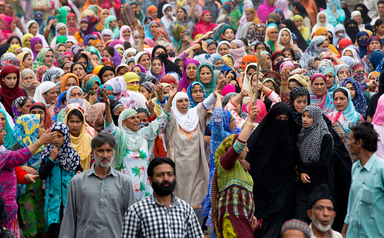 In this Friday, August 9, 2019, photo, Kashmiri women shout slogans during a protest march in Srinagar.