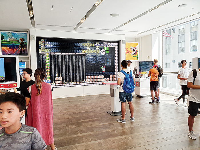 It’s just another day at Nintendo’s exclusive store at New York’s Rockefeller Center. You can play games on a giant screen.