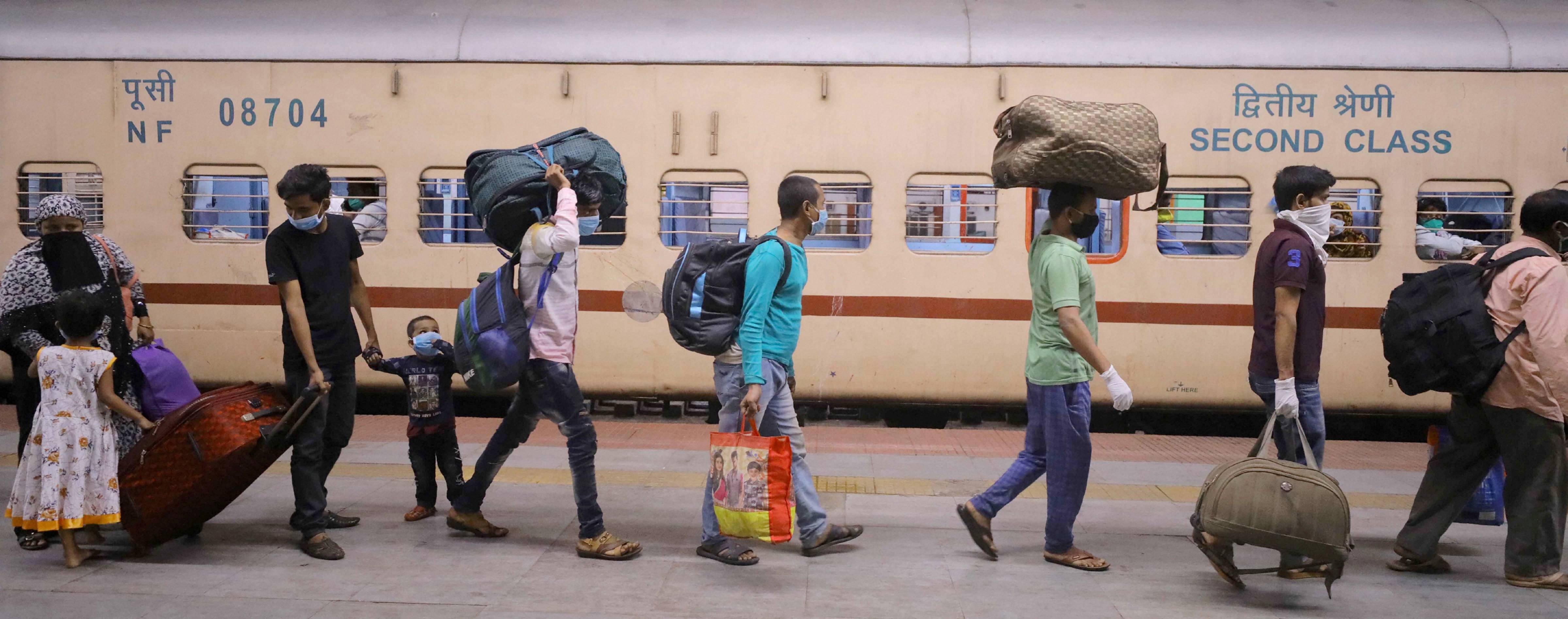 Passengers, traveling from Mumbai, arrive at Howrah Station by a special train during the fourth phase of Covid-19 nationwide lockdown, in Calcutta, Thursday, May 28, 2020