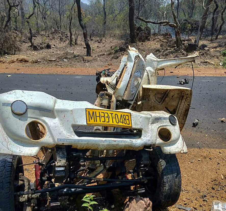 Mangled remains of a police vehicle that was blown up, allegedly by Maoist rebels, by using IED, while it was carrying 16 security personnel, in Gadchiroli district of Maharashtra, Wednesday, May 1, 2019. 
