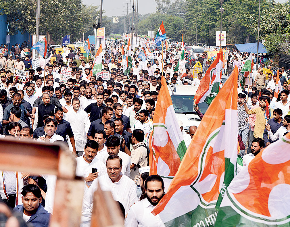 Rahul marches with a crowd of Congress workers towards the CBI headquarters in New Delhi on Friday.